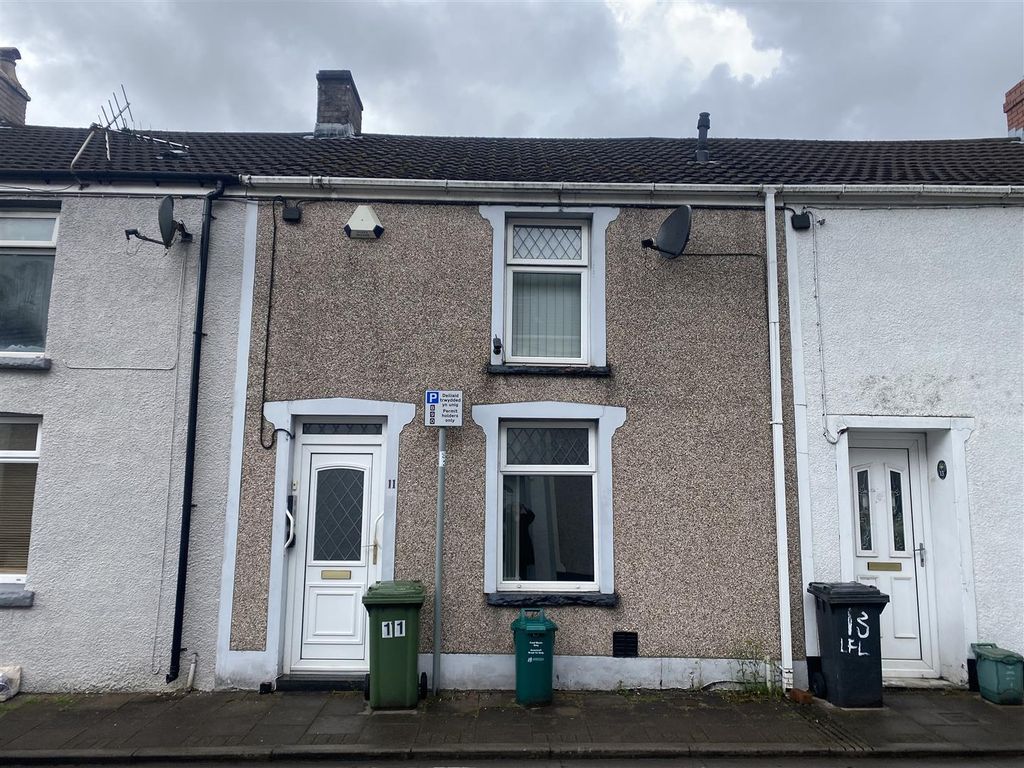 Terraced property with white render
